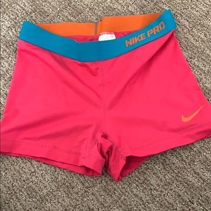 Pink and blue Nike Pros